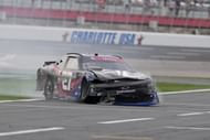Jeb Burton (27) crashes in the NASCAR Xfinity Series at Charlotte Motor Speedway. Source: Imagn
